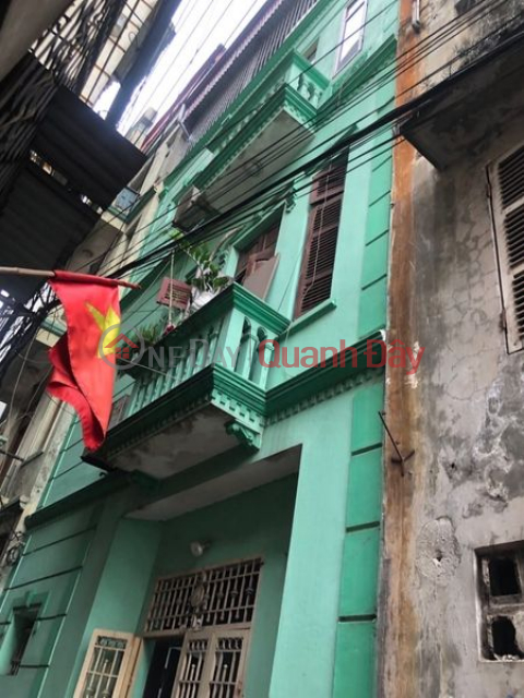 House for sale in Linh Nam 35m, people build a house on the street, car passes by the house _0